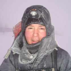 A photo of Great Outdoors Owner Director Derek Moody stopping for a breather on a long trekking trip in the Arctic Circle with Inge Solheim