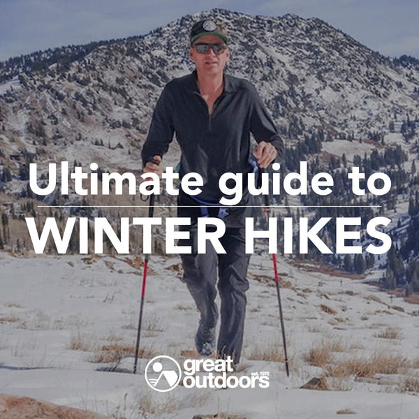 Man Hiking with poles on snow. Ultimate Winter Hikes Guide.