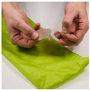 Taking off adhesive cover for tenacious tape silnylon patches