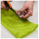 Cutting silnylon patches before applying to a tear