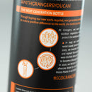 Close-up of a bottle label with text and icons on a gray background