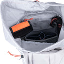 Gray backpack with orange accents, open to reveal compartments and items inside.