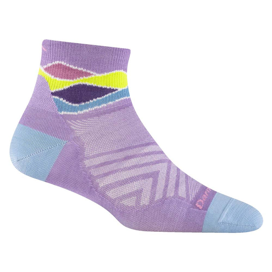 The Darn Tough Womens Run Quarter Ultra-Lightweight Running Socks feature a lavender base with light blue heel and toe, moisture-wicking Merino wool, geometric patterns in purple, white, yellow, dark blue near the cuff, and diagonal lavender foot stripes.
