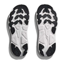 A pair of white soles with black tread patterns, side by side on a white background. Designed for the Hoka Womens Clifton 10 Wide Running Shoe, they feature textured grips and the embossed HOKA logo in the center.
