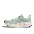 The Womens Clifton 10 Wide Running Shoe by Hoka features a light green mesh upper, white sole, orange, yellow, and red accents, a wavy midsole design, and a red logo near the heel.