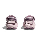 The Womens Infini Hike TC Trail Sandal by Hoka in light purple features adjustable heel straps and textured soles inspired by Hoka running shoes, shown from the back.