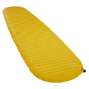 Bright yellow, mummy-shaped Therm-a-Rest NeoAir XLite NXT Sleeping Pad with horizontal baffles and a black inflation valve at the foot.