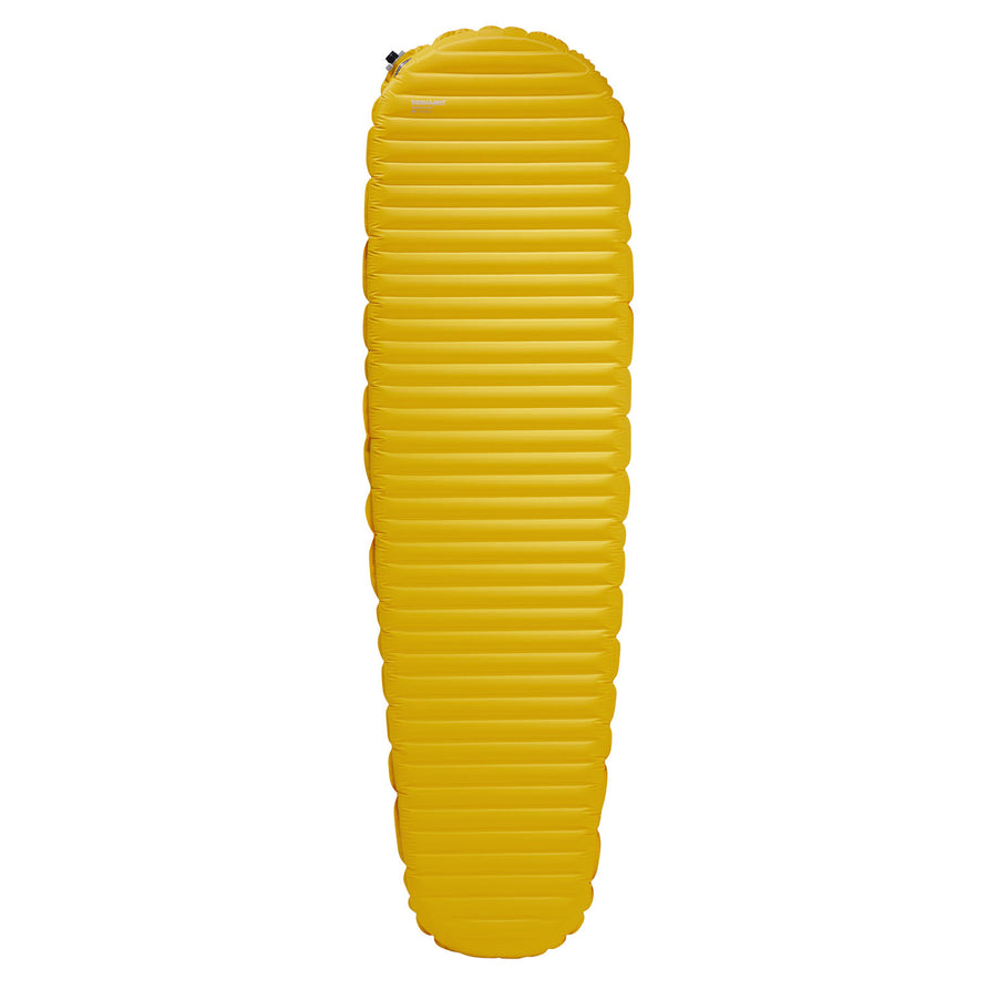 A bright yellow, mummy-shaped Therm-a-Rest NeoAir XLite NXT sleeping pad featuring horizontal baffles.