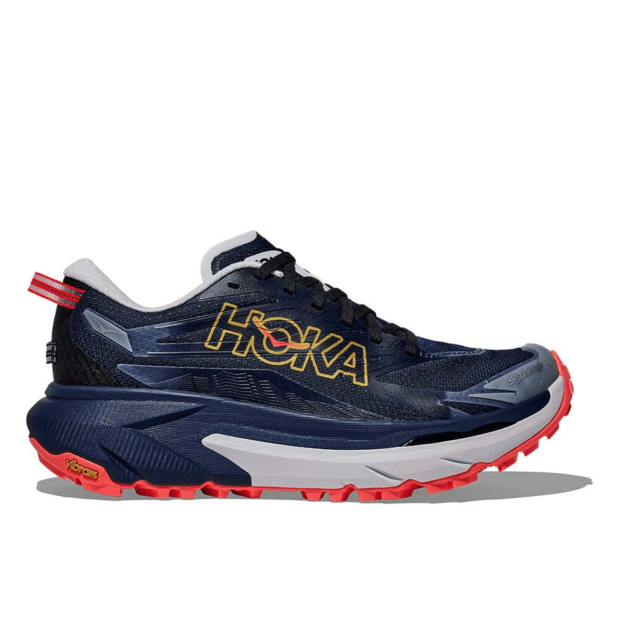 The Women’s Mafate 5 Trail Running Shoe by Hoka features a navy blue upper, yellow logo, red heel tab and sole accents, white midsole, black laces, thick cushioning, and rugged tread—hallmarks of Hoka trail shoes.
