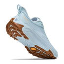 Light blue Hoka Womens Transport 2 trail running shoe featuring a textured brown rubber sole, displayed at an angle to showcase the tread and heel—versatile city-to-trail sneakers crafted for all-day comfort.