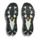 Pair of black and light gray Mens Speedgoat 7 Trail Running Shoe soles by Hoka, featuring rugged, multi-directional tread for superior grip; yellow Vibram logos visible near the arches.