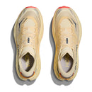 Top view of a pair of beige Hoka Womens Speedgoat 7 Trail Running Shoes with mesh uppers, light orange accents on the toes and heels, and HOKA branding on the tongues and sides, set against a white background.