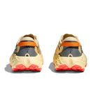 Rear view of a pair of Hoka Womens Speedgoat 7 Trail Running Shoes with beige and gray uppers, orange pull tabs, and bright red outsoles, displayed on a white background.