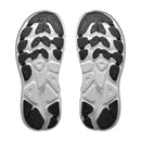 Two white outsoles with black rubber tread patterns are shown from the bottom, displaying a textured design that enhances grip and traction. The Hoka brand name is visible on both soles, referencing the Hoka Womens Clifton 11 Running Shoe—a cushioned daily trainer engineered for comfort and reliable performance.