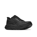 A black Hoka Womens Clifton 11 Wide Running Shoe featuring a thick, textured sole and Hoka branding on the side, displayed at an angle against a plain white background. This shoe is engineered for maximum comfort and support with its cushioned design.