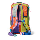 A vibrant and sustainable Cotopaxi Allpa 28L Travel Pack - Del Día is shown from the back on a white background, highlighting its padded multicolored shoulder straps, mesh sections, and adjustable blue and purple buckles—making it an eye-catching choice for travel.