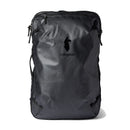 A Cotopaxi Allpa 35L Travel Pack in black stands upright against a white background, showcasing the brand’s minimalist llama logo, zippered compartments, and durable construction from recycled fabrics.