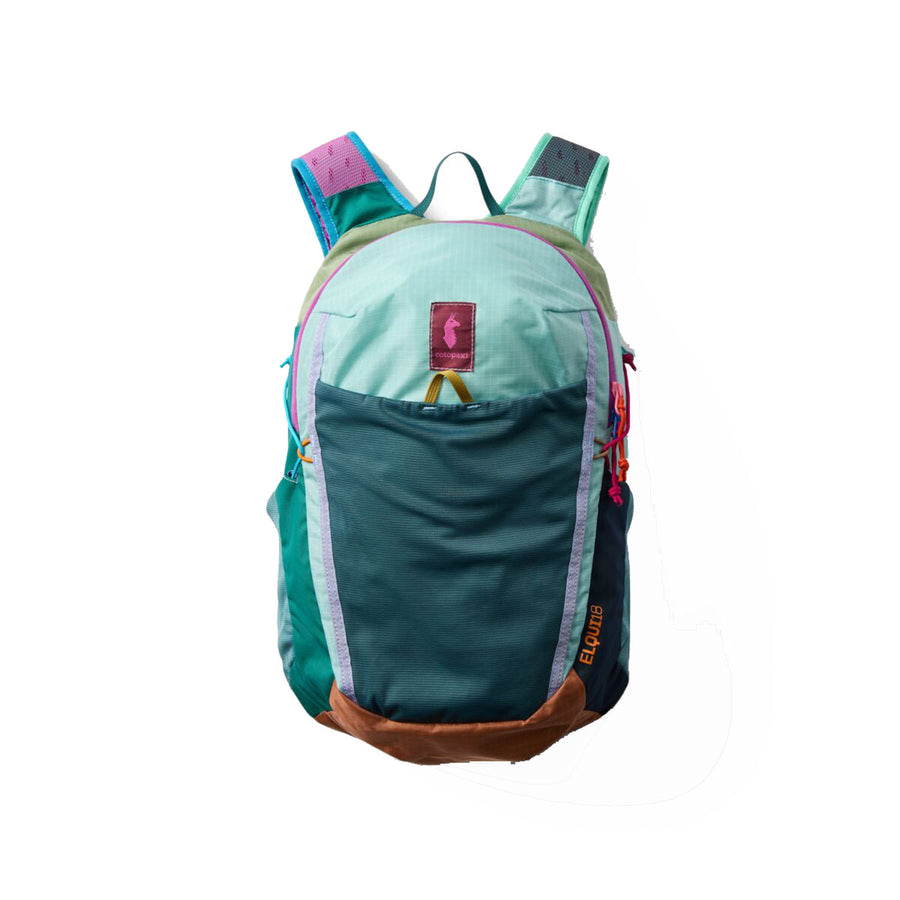 A vibrant daypack constructed from green, teal, blue, and brown deadstock nylon panels with a purple zipper, orange EQUIP logo, and multicolored straps—the Cotopaxi Elqui 18L Backpack - Del Día is photographed against a white background.