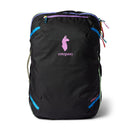A Cotopaxi Allpa 35L Travel Pack - Del Día Dark, featuring a black base with blue accents, colorful zippers, and a pink llama logo on the front, is displayed upright against a white background—highlighting its distinctive sustainable design.
