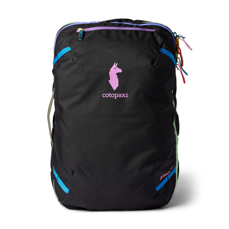 A Cotopaxi Allpa 35L Travel Pack - Del Día Dark, featuring a black base with blue accents, colorful zippers, and a pink llama logo on the front, is displayed upright against a white background—highlighting its distinctive sustainable design.