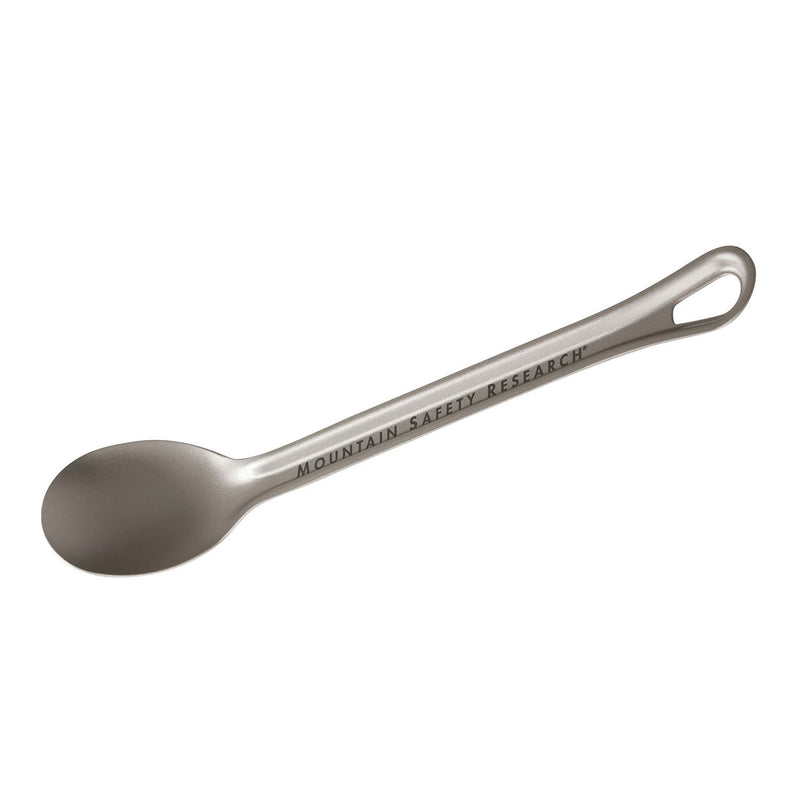 A titanium Titan Long Spoon by MSR, featuring an extended handle engraved with the MSR logo and a hanging hole at the end—an essential backcountry utensil ideal for any ultralight camp cookware setup.