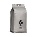 A 200g bag of loose white gold climbing chalk with the Black Diamond logo on it.