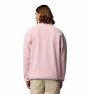 A person with shoulder-length hair is seen from behind, wearing the Columbia Mens Helvetia Half Snap Fleece in light pink and beige pants, posed against a plain white background.