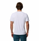A man with short brown hair is seen from behind wearing a plain white Columbia Mens Zero Rules™ Light Technical T-Shirt and teal pants, set against a white background.