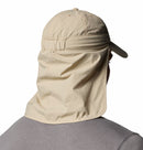 A person wearing a Columbia Schooner Bank II Cachalot Hat in light beige with a long neck flap (UPF 50), seen from behind. The hat covers their neck and part of their shoulders. Theyre also wearing a gray shirt.