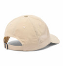 The Columbia Tech Shade II Cap in beige features a curved brim, mesh side panels for ventilation, and an adjustable strap with a metal buckle. Shown from the rear on a white background, this hiking hat is lightweight and comfortable.