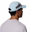 A man, shown from behind and slightly to the side against a white background, wears a Columbia Tech Shade II Cap with mesh side panels and a light gray t-shirt.