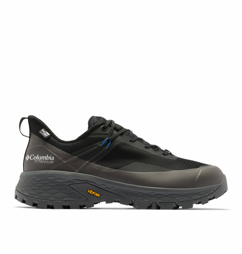 A black Columbia Mens Tellurix Titanium Outdry Hiking Shoe with Omni‑Max Plus tech, Vibram Megagrip outsole, mesh and synthetic upper, and blue lace eyelet accents, shown side view on a white background.