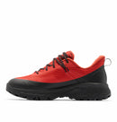 The Columbia Mens Tellurix Titanium Outdry Hiking Shoe is a red and black low-top with rugged black Vibram Megagrip soles and matching laces, shown from the side on a white background.