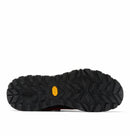 The image shows the black, textured Vibram Megagrip outsole of the Columbia Mens Tellurix Titanium Outdry Hiking Shoe, featuring deep, rugged treads and a small yellow logo. The shoe is sole-up against a white background.