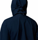 A close-up shows a person from the back wearing Columbia’s Women’s Trailborne 2.5L Waterproof Shell Jacket in dark navy, hood up with visible adjustable drawstring, against a plain white background.