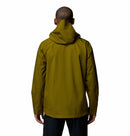 A person faces away from the camera, wearing a Columbia Mens Trailborne 2.5L Waterproof Shell Jacket in olive green with Omni-Tech and black pants, set against a plain white background.