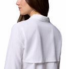 A woman with long brown hair is shown from the back and side wearing the Columbia Womens Silver Ridge Utility II Long-Sleeve Shirt, which features a white collar and UPF 50 sun protection. The background is plain white.