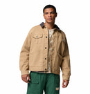 Man wearing a beige Columbia twill casual jacket and green pants on a white background