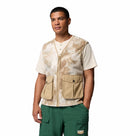 Man wearing a beige soft fleece Columbia vest with multiple pockets on a white background