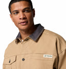 Man wearing a beige jacket with a Columbia logo on a white background