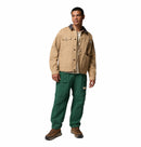 Man wearing a Columbia beige jacket and green pants on a white background