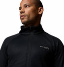 A man wears a black Columbia Mens Summit Step™ Full Zip Technical Fleece, noted for its lightweight design, and looks to the side against a plain white background.
