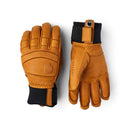 The Hestra Men’s Fall Line Glove—shown in tan leather with black wrist cuffs and reinforced stitching, presented palm up and palm down on a white background—delivers premium protection and style for ski glove enthusiasts.