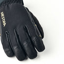 A close-up of a black Hestra Army Leather GORE-TEX Short Glove featuring visible stitching and textured material, displayed on a white background. The HESTRA brand name appears in gold letters on this waterproof winter glove.
