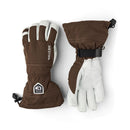 A pair of Hestra Army Leather Heli Ski Gloves in brown and white, featuring long cuffs, adjustable wrist straps, and a logo patch on the left cuff. One glove is shown palm up and the other palm down—a premium item from Hestra’s Alpine Pro collection.