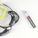 Goggles with a bottle of anti-fog spray on a white background