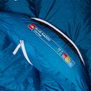 Close-up of a blue three-season sleeping bag labeled Blue Kazoo Down Sleeping Bag (-7°C) by The North Face, showing temperature ratings of 20°F and -7°C on the inner flap, designed for versatile comfort during outdoor adventures.