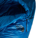 A close-up of a blue The North Face Cat’s Meow Sleeping Bag (-7°C), showing the brand logo and part of the hood with a visible drawstring. This sleeping bag features recycled synthetic insulation for reliable warmth on your adventures.