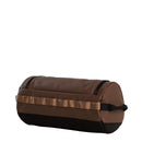 A Base Camp Travel Washbag - Large by The North Face, featuring a brown cylindrical design with black ends and a matching brown handle, displayed on a white background—ideal as a durable travel toiletry bag among your essential accessories.