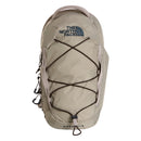 A Borealis Sling Bag by The North Face in beige, featuring a top handle, front elastic bungee, side pocket, and a prominent logo on the upper front—designed as a compact sling bag ideal for carrying your daily essentials.